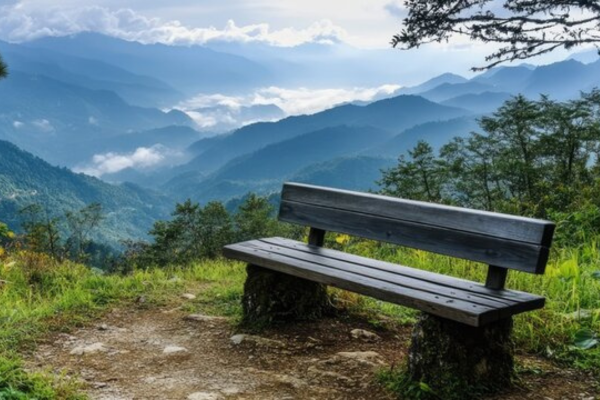 Benches facing Naini Lake with mountains in front. 