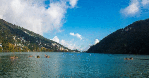 A scenic shot of Nainital Lake with hills in the background