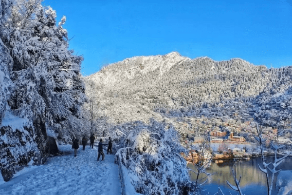 A scenic shot of snowfall around Nainital Lake or Snow View Point.